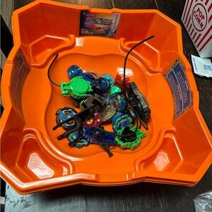 Hasbro Orange Beyblade Battle Arena with Multicolor Tops and Launchers